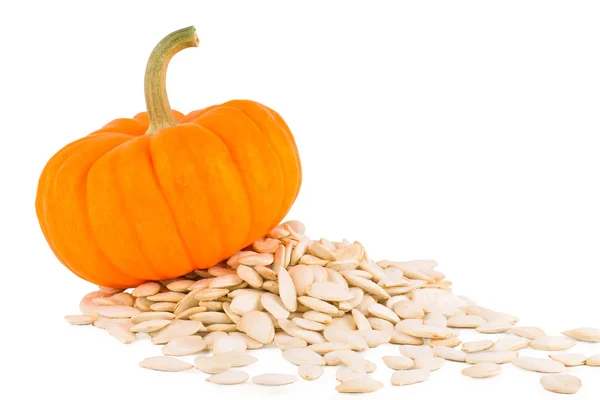 Pumpkin on a white background with  pumpkinsseeds — Stock Photo, Image