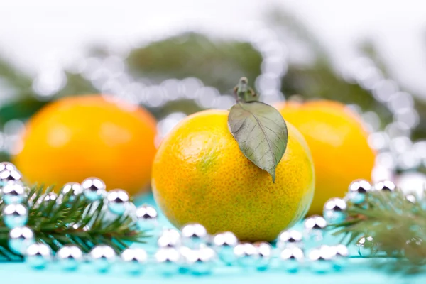 Tangerines, baubles and fir-tree cones — Stock Photo, Image