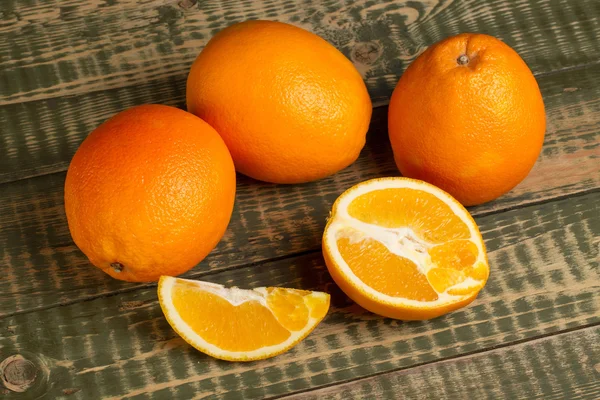 Some oranges on an wooden table — Stock Photo, Image