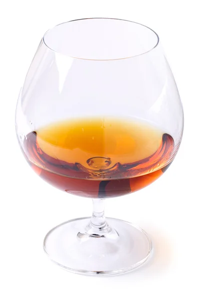 Glass with cognac on white background — Stock Photo, Image