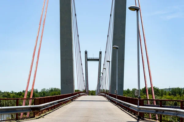 Suspension bridge over the Danube, with an extraordinary architecture, near the Portile de Fier 2 Hydropower Plant, on the island of Ostrovu Mare, Romania