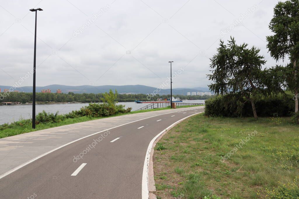 Summer embankment of the Yenisei River in the city of Krasnoyarsk.