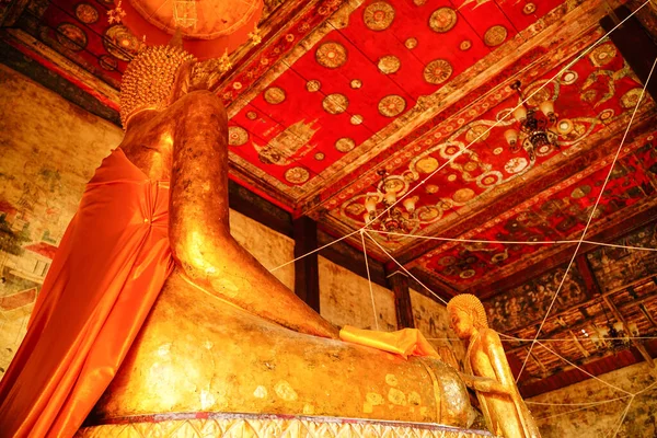 Buddha statue image take in ancient temple in Thailand or wat. This heritage spirituality of golden buddha face is beautiful attraction and be the landmark when travel. An old sculpture holy design.