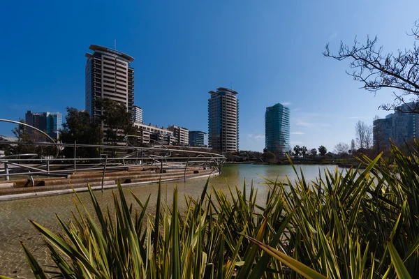 Barcelona,Spain, March 2016: artificial river in parc Diagonal Mar with view on modern skycaps — Stock Photo, Image