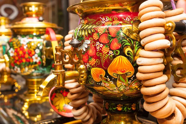 Khokhloma painted traditional Russian samovar with bunch of crac