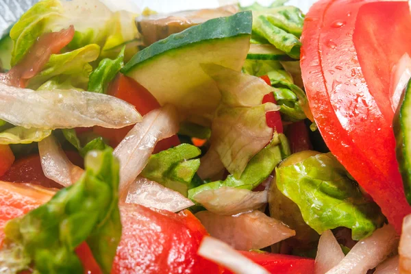 Salad with fresh tomatoes cucumbers and onion — Stock Photo, Image