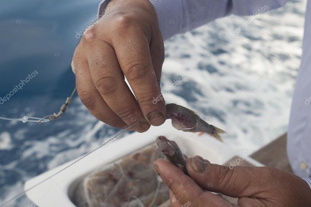 Fisherman put bait on the hook — Stock Photo © johnqsbf #81246514