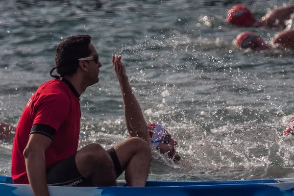 CHRISTMAS DAY HARBOUR SWIM 2015, BARCELONA, Port Vell - 25th December:Lifesavers watched for competitors