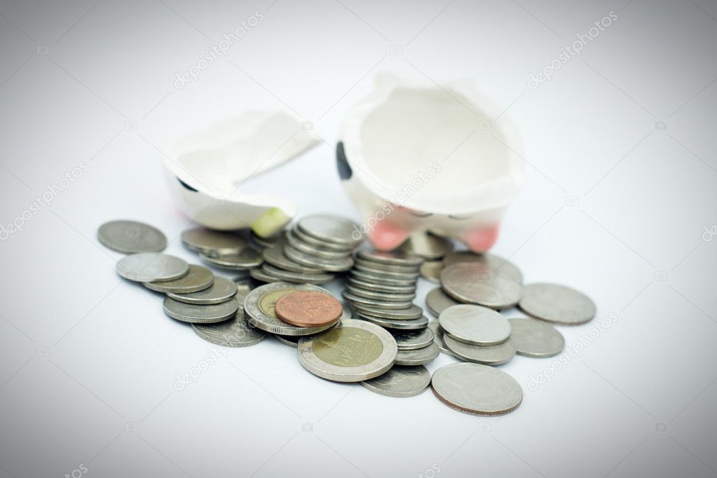 Thai stack coins with broken piggy bank on white background, financial concept photo