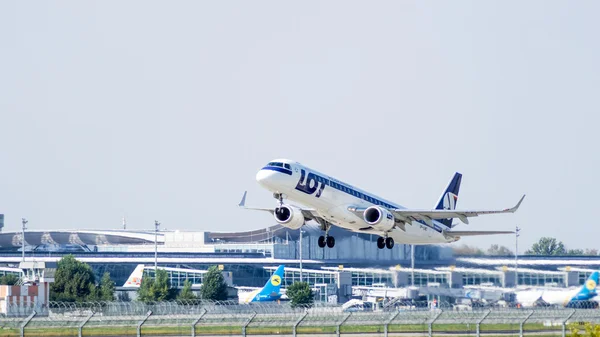 Aircraft Embraer by LOT - Polish Airlines take-off — Stock Photo, Image