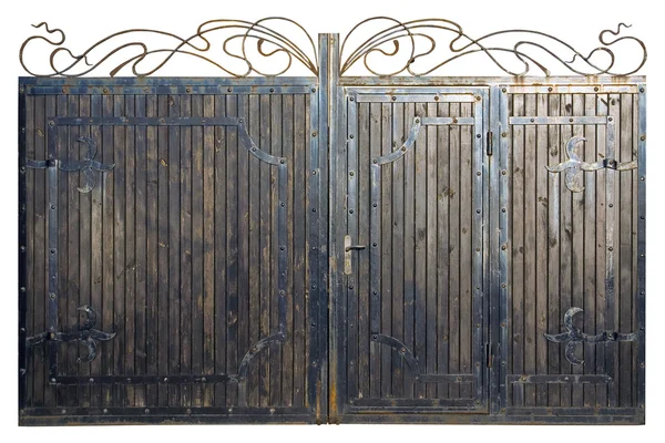 The gate made of wood and metal. Old forged ornament on wooden g — Stock Image The gate made of wood and metal. Old forged ornament on wooden g Stock Picture
