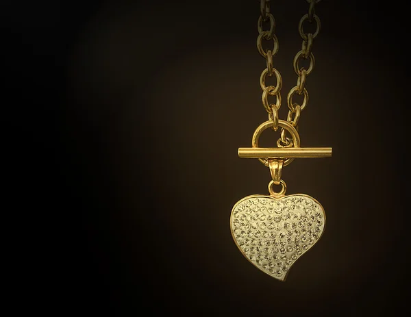 Gold necklace with a heart — Stock Photo, Image