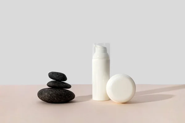 Bottles Cosmetic Cream Balancing Stones Beige Background Sunlight Minimal Style — Stock Photo, Image