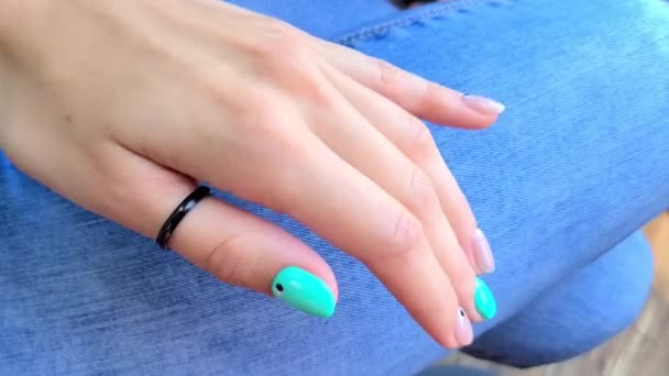 Womans hands with trendy turquoise nail design — Stock Video