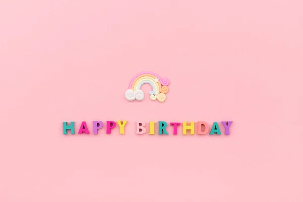Happy birthday inscription from wooden colorful letters with rainbow — Stock Photo, Image