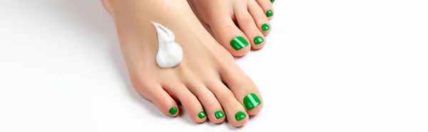 Woman apply cream on feet on white background — Fotografia de Stock