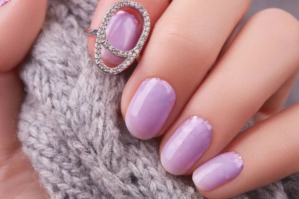 Womans hand with fashionable lavender manicure. Winter christmas nail design — Stock Photo, Image