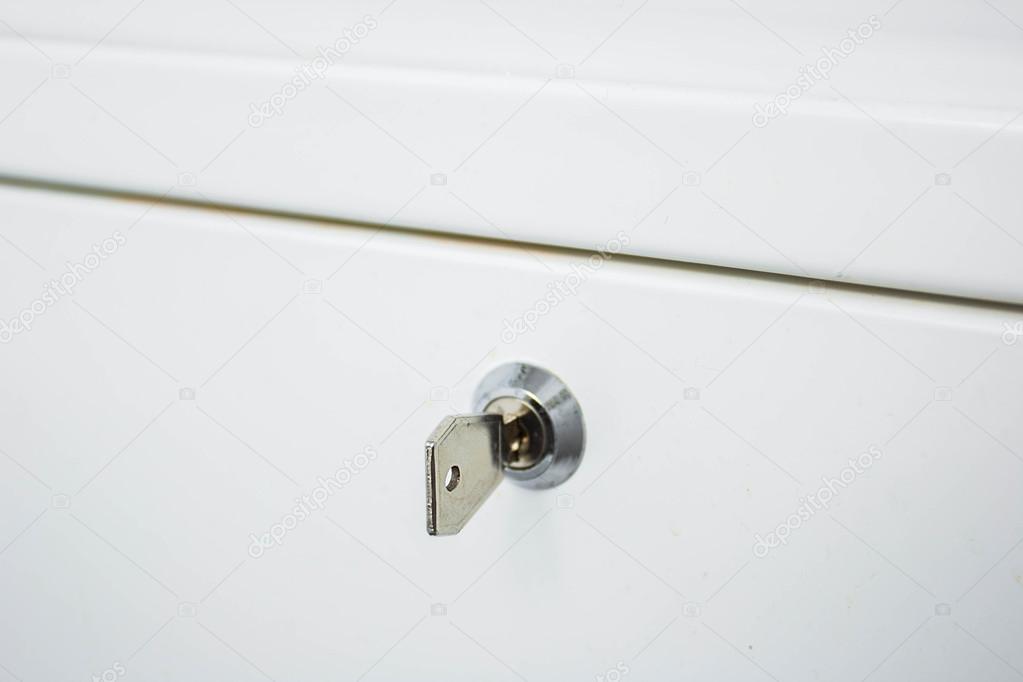 key in the lock on a white background