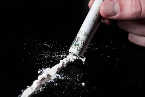 Cocaïne en geld op de tafel — Stockfoto