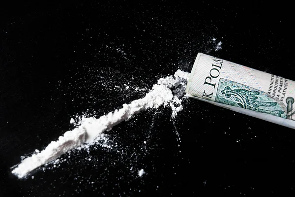 Cocaïne en geld op de tafel — Stockfoto