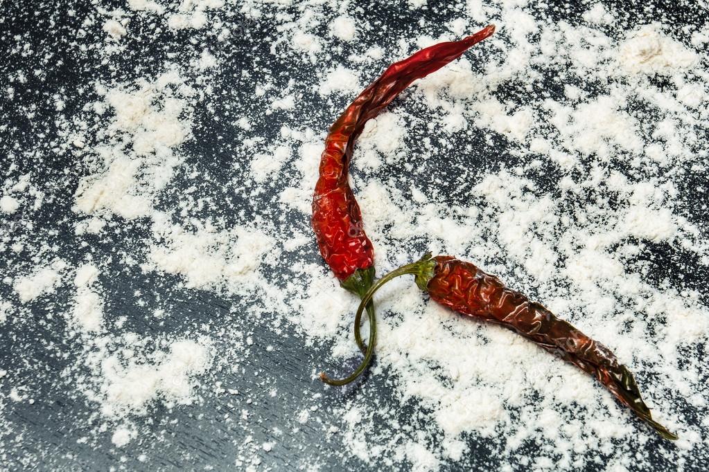 Dried chili peppers on a dark background