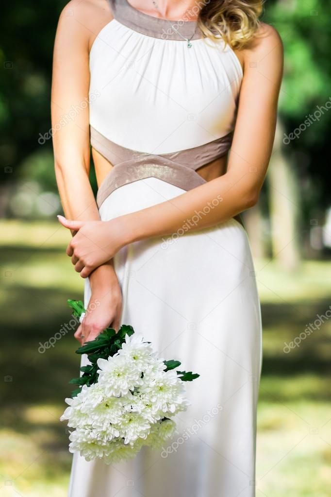 beautiful  young girl with a bouquet of flowers