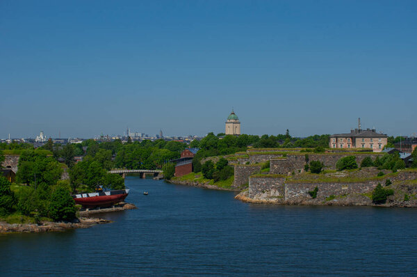 View of Helsinki and island onshore of Baltic Sea with the city on the background.
