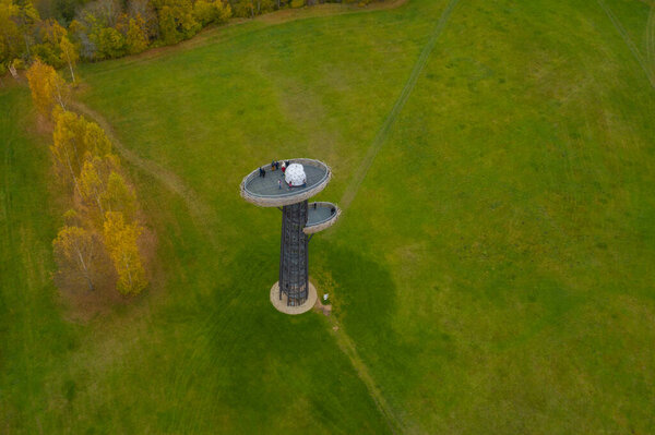 Aerial view of observation tower Nesting Tree (estonian Pesapuu) in Rouge on a cloudy autumn day.