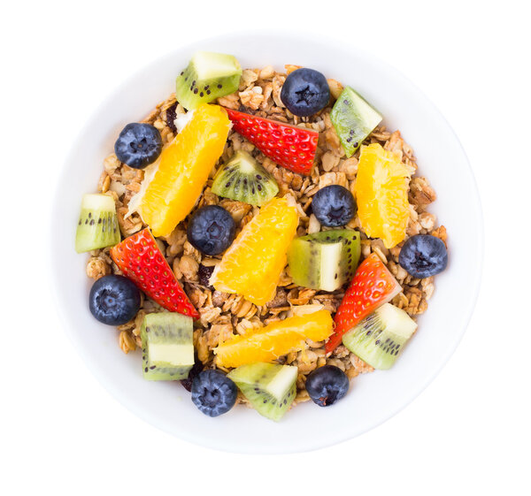 Muesli, fruit, berries in a bowl on a 