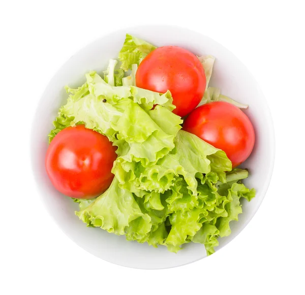 Tomates y verduras en un plato — Foto de Stock