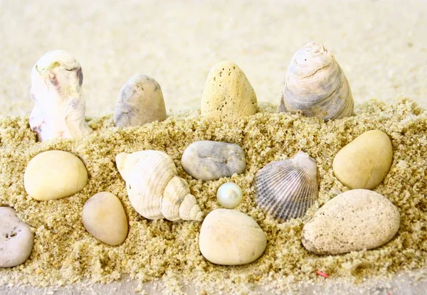 Άμμος, θάλασσα και βότσαλα — Φωτογραφία Αρχείου