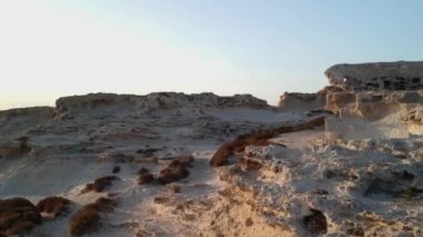 Magnificent scenery of rough rocky formation on background of sundown sky in evening
