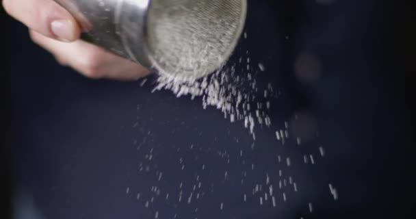 Closeup Crop Cook Using Metal Sifting Shaker Dark Blurred Background — Stock Video