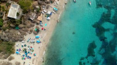 Spectacular aerial view of calm sea with clear turquoise water and rocky coastline