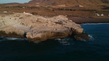 Spectacular aerial view of calm sea with clear turquoise water and rocky coastline