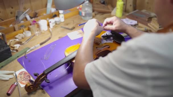 Crop Male Artisan Master Setting Violin Bow Restoration Work Workshop — Stock video