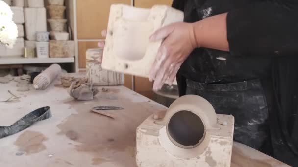 Crop Anonymous Female Master Apron Putting Clay Pot Out Mould — Stock Video