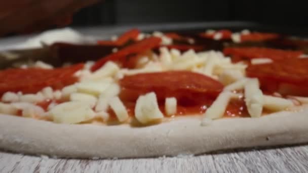 Closeup Zoom View Anonymous Pizzaiolo Putting Sliced Salami Raw Pizza — Stock Video