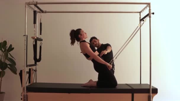 Side View Concentrated Female Athlete Doing Exercises Pilates Reformer While — Stock Video