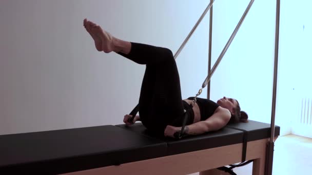 Slim Female Sportswear Doing Exercises Cadillac Reformer Pilates Workout — Stock Video