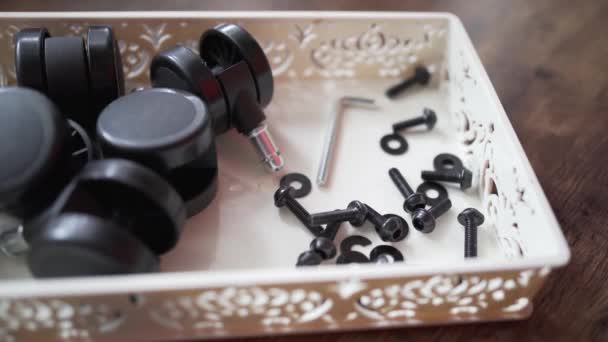 Anonymous Female Picking Washer Plastic Container Screws Wheels While Assembling — 图库视频影像