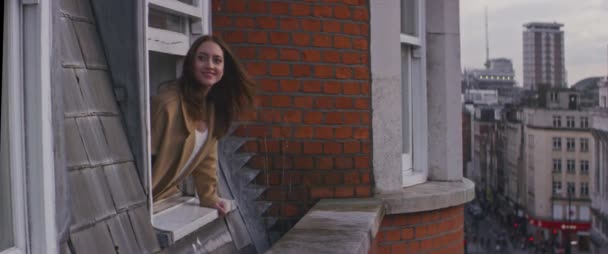 Woman Smiling Leaning Out Window Looking View — Stock Video