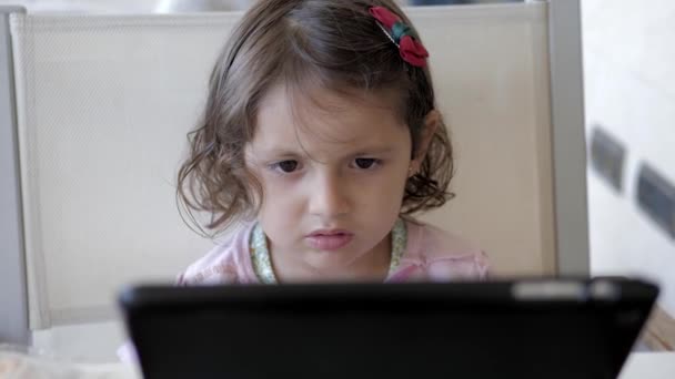 Little Cute Girl Watching Tablet Computer Home — ストック動画