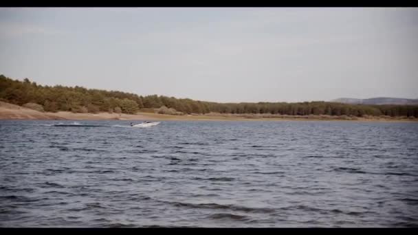 Motorboat Riding Rippling Lake — Stock Video