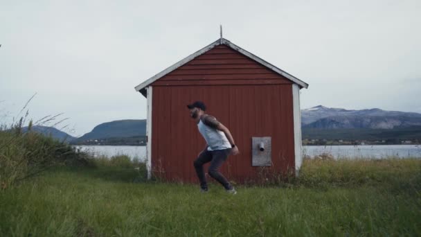 Excited Man Jumping Shore Lake — Vídeos de Stock