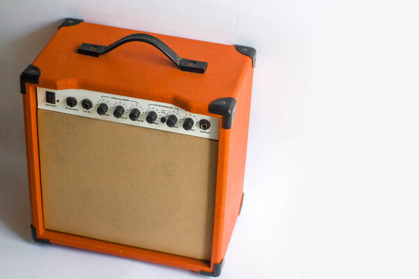 Orange Color Guitar Amplifier Speaker Sound System with Place for Text in White Background