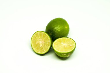 Sliced Fresh Lime with One Behind Isolated in White Background