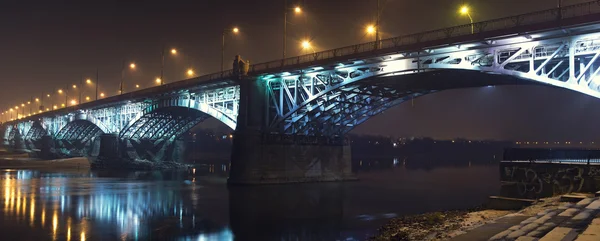 Bridge illuminated at night in the fog. Poniatowski Bridge — Stock Photo, Image