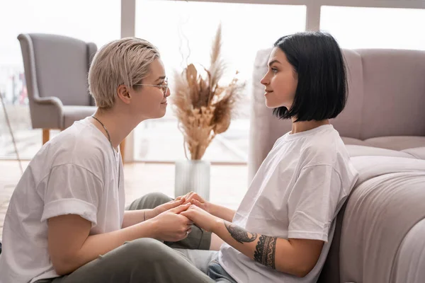 Side View Cheerful Lesbian Couple Holding Hands Living Room — Stock Photo, Image