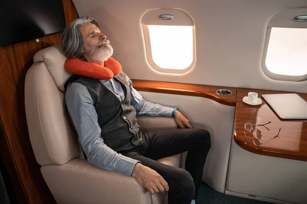 Mature Businessman Neck Pillow Sleeping Laptop Coffee Private Jet — Stock Photo, Image